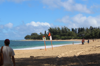 Expansive Hā’ena coastline with sweeping ocean vistas and lush greenery.