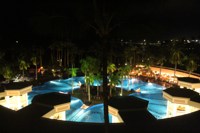 Nighttime view of the Marriot Resort and Spa’s illuminated pool area.